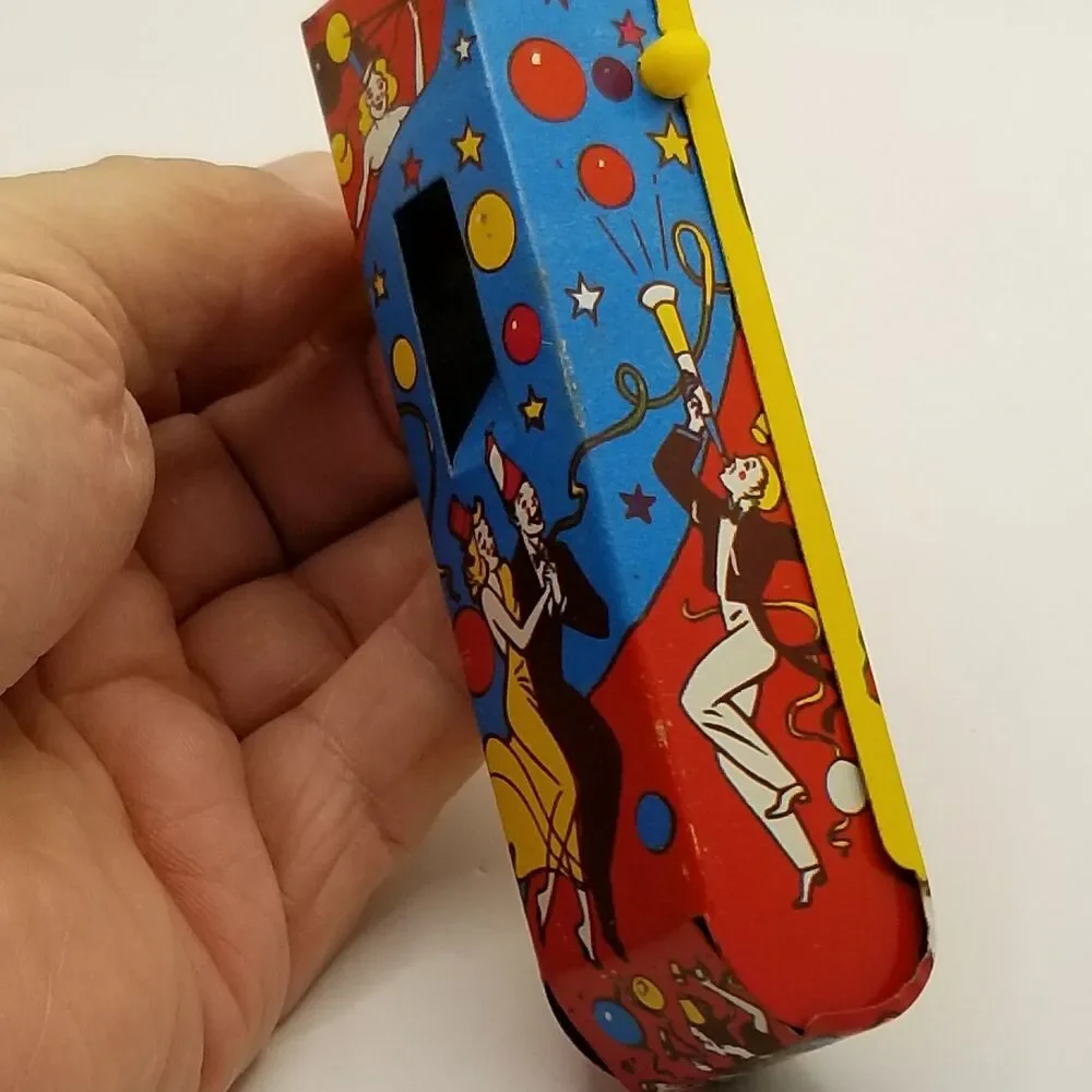 vintage tin lithograph ratchet style US Metal Toy Co noisemaker party theme